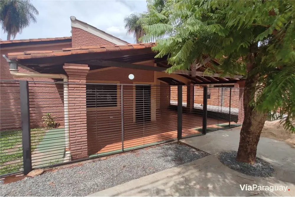 House and two paired duplexes for sale in Luque