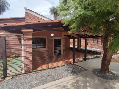 House and two paired duplexes for sale in Luque