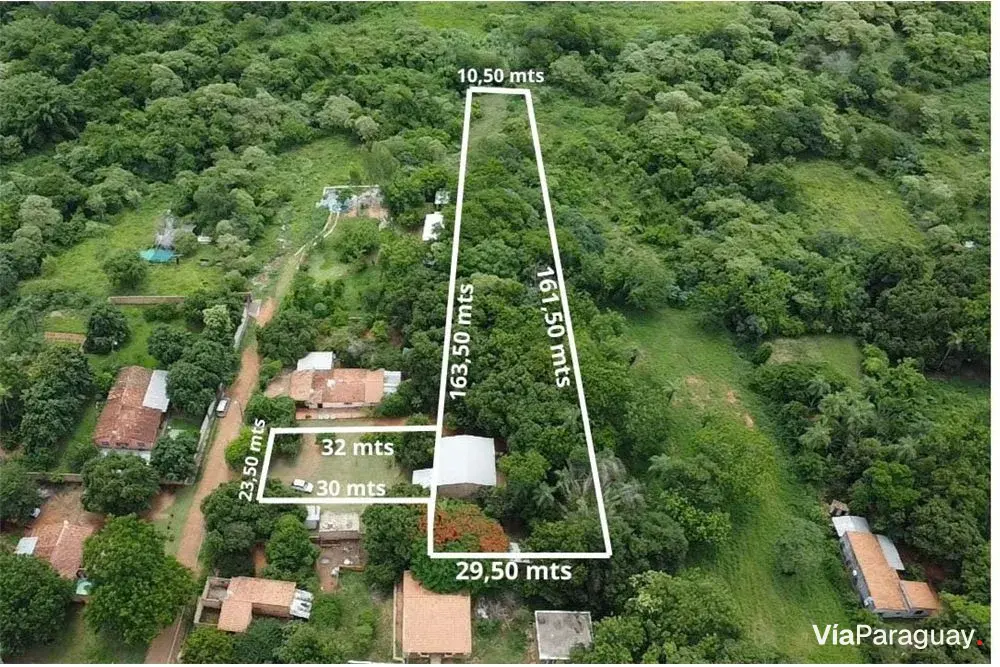 Terreno à venda com galpão habitável em Itauguá
