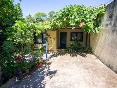 Casa à venda em Villa Elisa com jardim e salão comercial 3