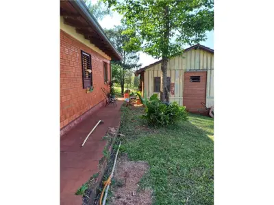 Terreno com construção à venda em Colonia Obligado km 12 4