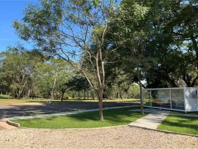 Terreno à venda em condomínio fechado em Villa Elisa 5