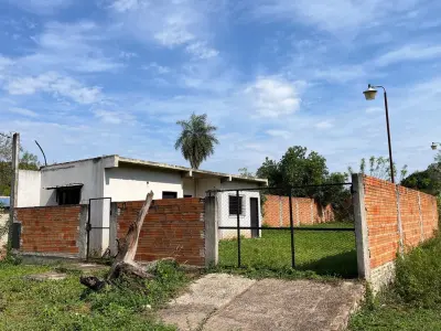 Terreno à venda em Capiatá com construção 2